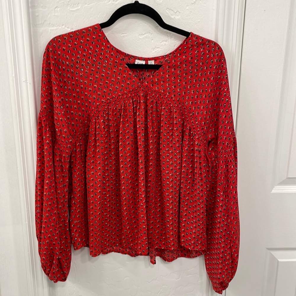 Red blouse with flowers. Fits like a small / medium